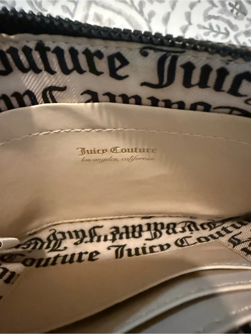 Juicy Couture Black Embossed Logo Wristlet with Gold Plaque